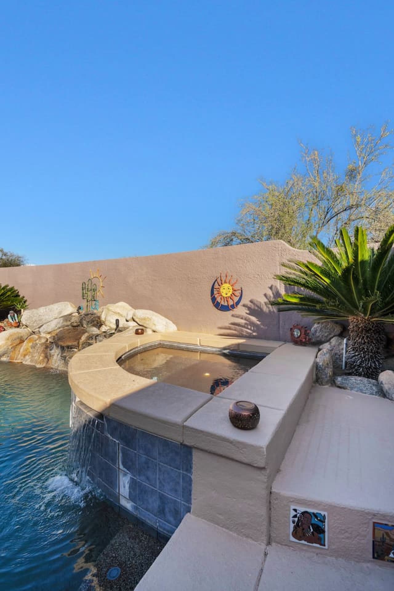 Poolside seating area perfect for soaking in the sun and unwinding.