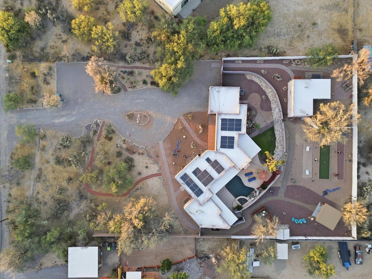 Aerial view highlighting the full property layout and expansive grounds.