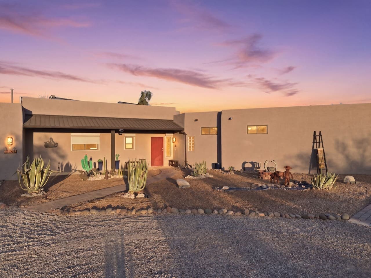 Beautiful home exterior glowing at sunset with warm inviting tones.