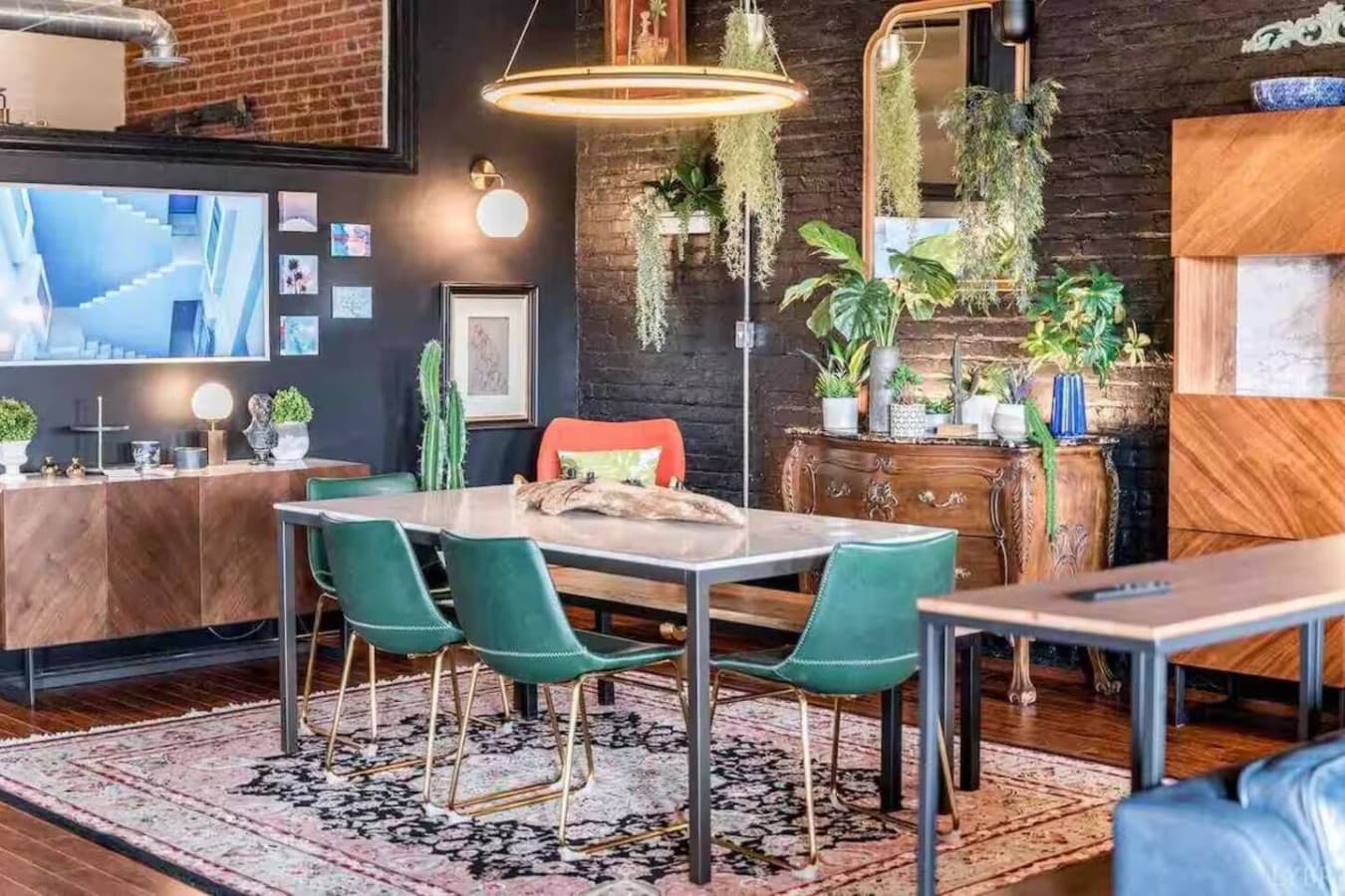 Dining table with comfortable seating and statement lighting.