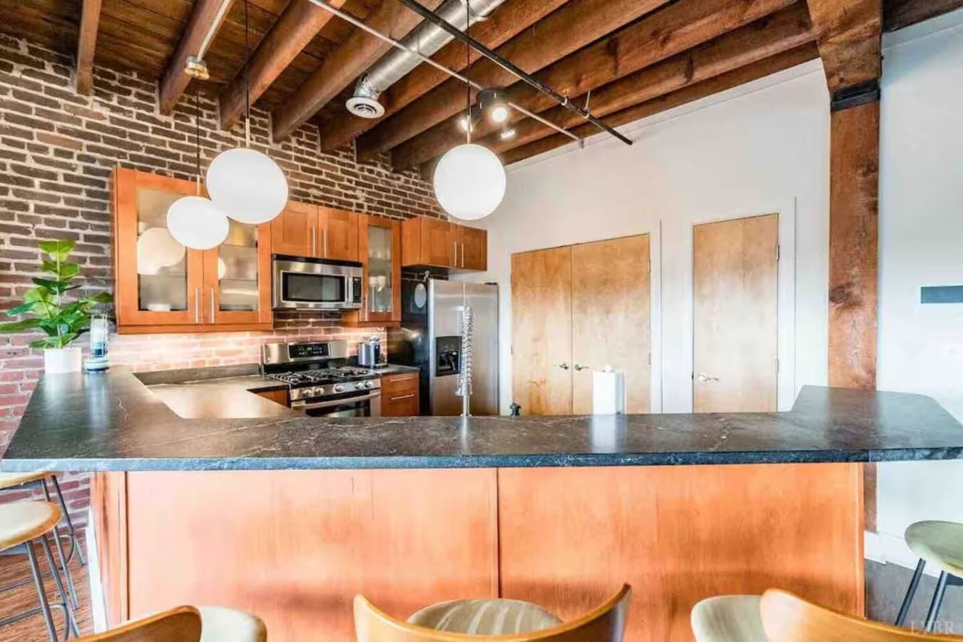 Breakfast bar seating perfect for casual meals or morning coffee.