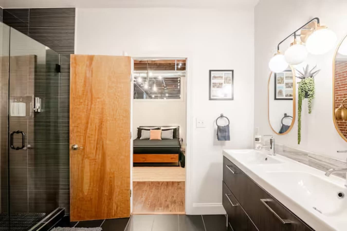 Bathroom entry with vanity and bedroom access.