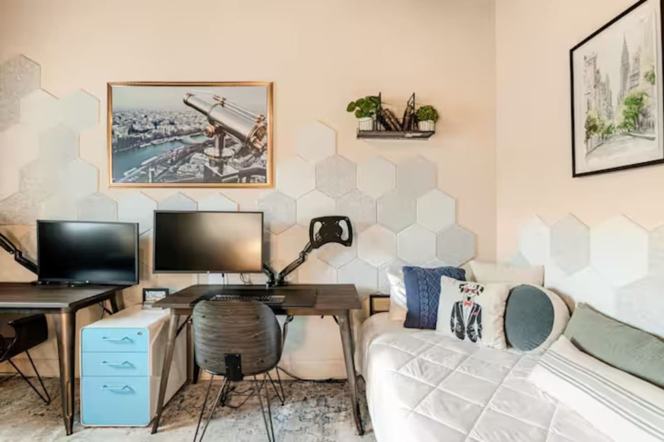 Functional bedroom with work area with desk, TV, and modern decor.