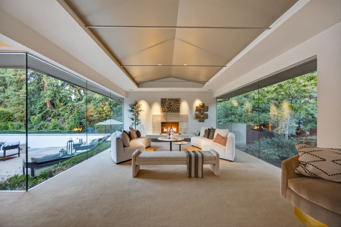 Serene great room with panoramic greenery views and a bright open layout ideal for entertaining.