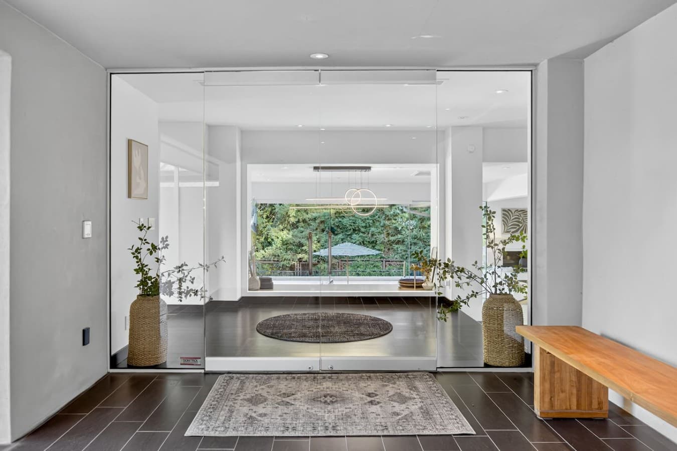 Dramatic glass walls and open sightlines showcase the home's thoughtful design and connection to nature.