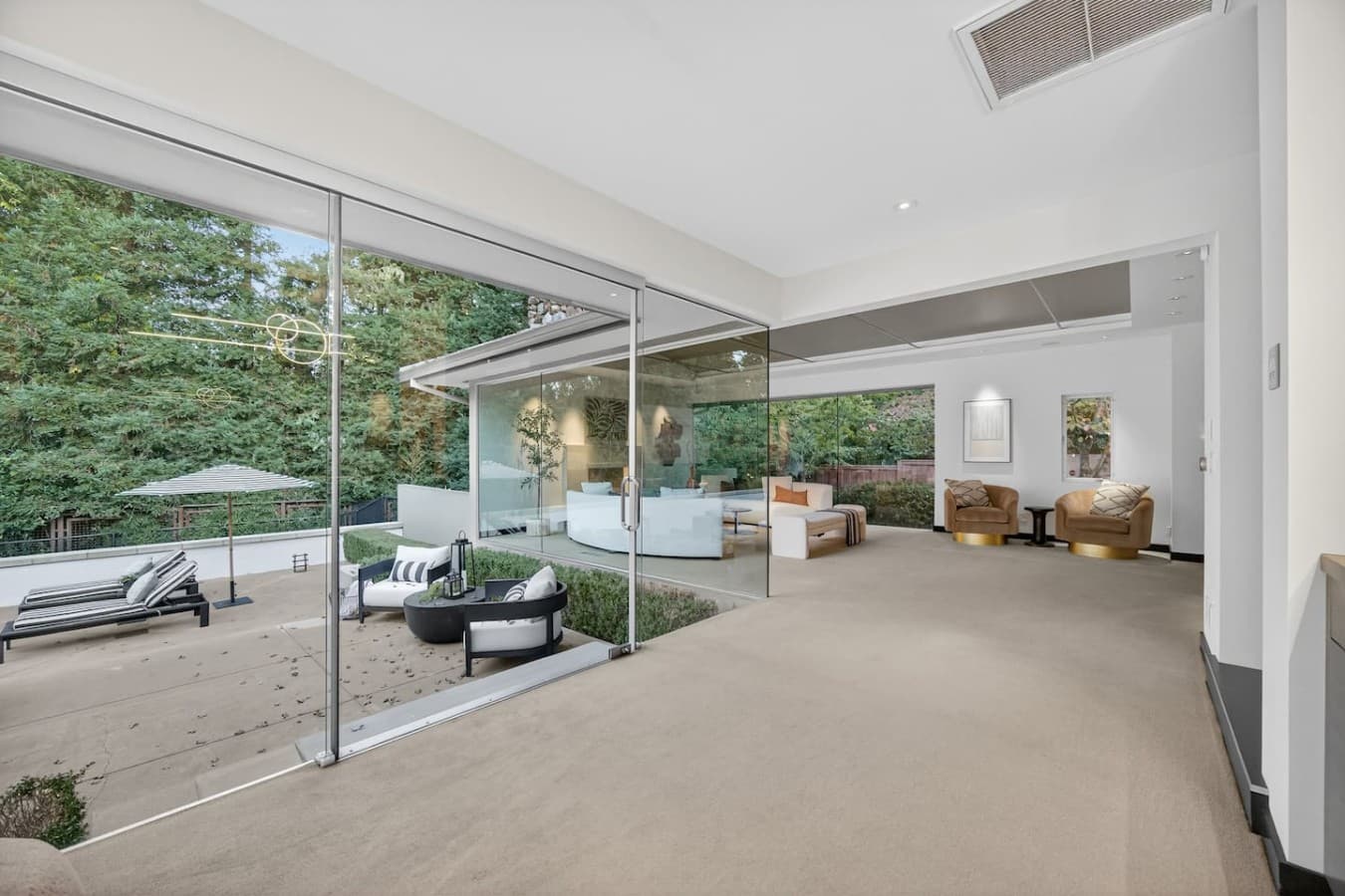 Bright indoor outdoor living space designed to maximize natural light and seamless connection to nature.