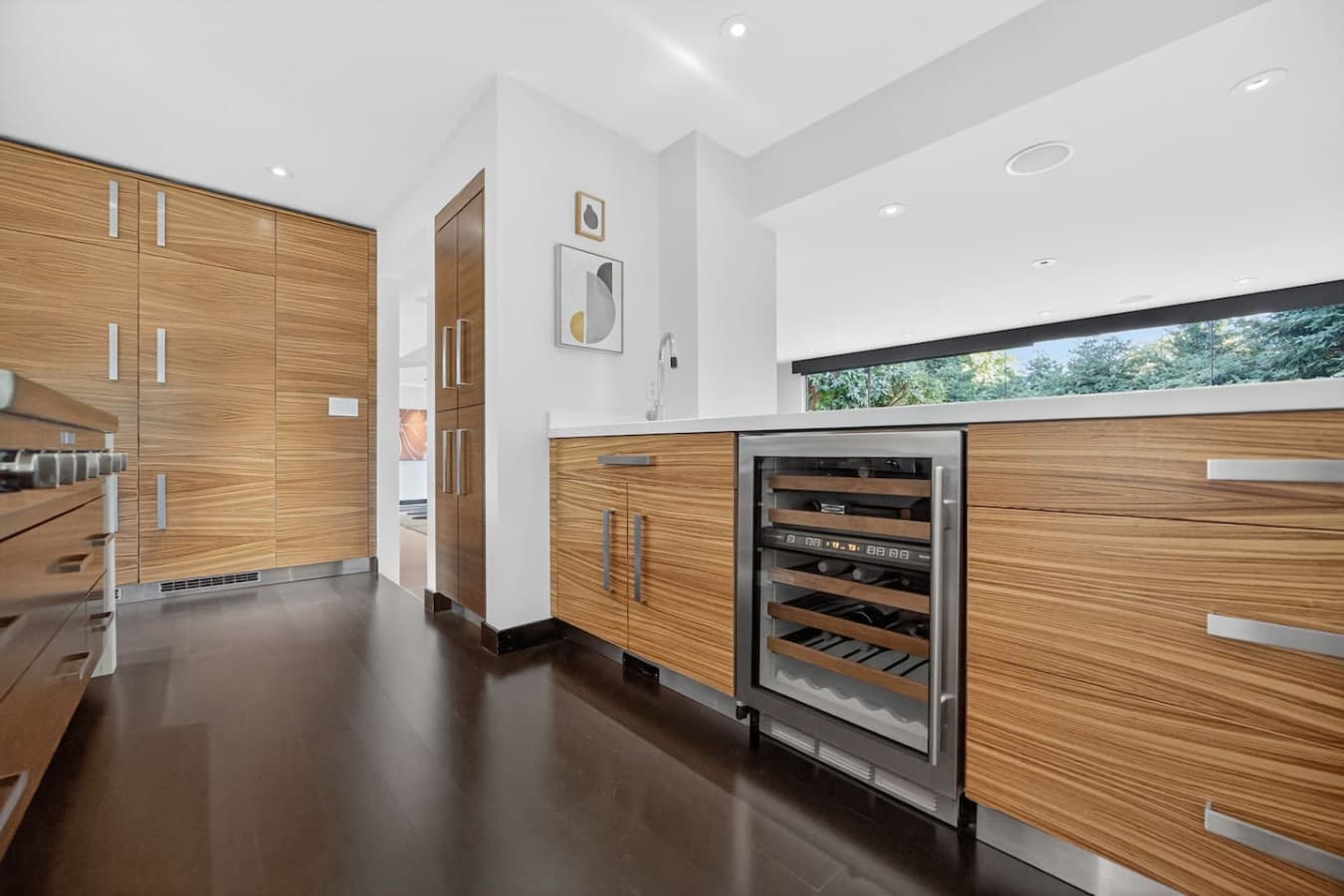 Built in wine storage and extensive cabinetry provide thoughtful convenience for everyday living and hosting.