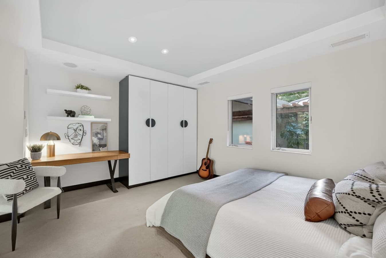 Thoughtfully designed retreat with ample storage, a dedicated workspace, and peaceful natural light throughout.