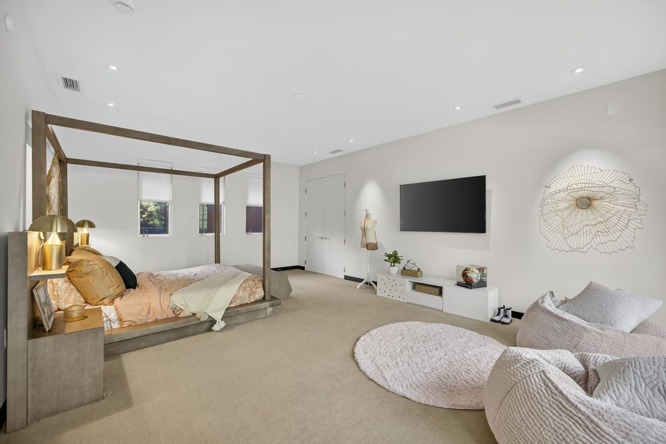 Generous suite with a comfortable lounge area, wall mounted entertainment, and plenty of room to unwind.