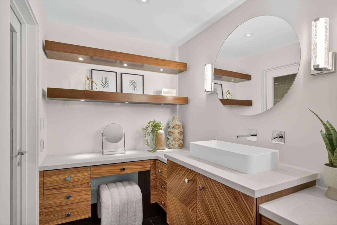 Custom vanity with designer cabinetry, generous storage, and elegant modern styling.