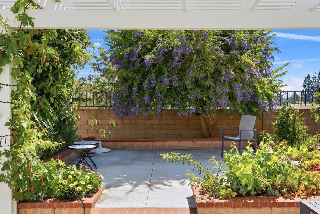 Peaceful garden retreat with mature landscaping and seating areas.