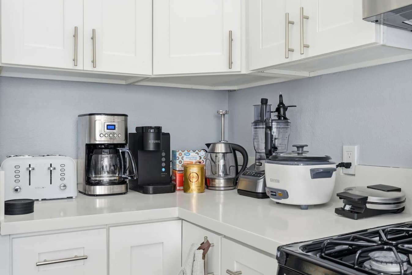Coffee station with small appliances for added convenience.