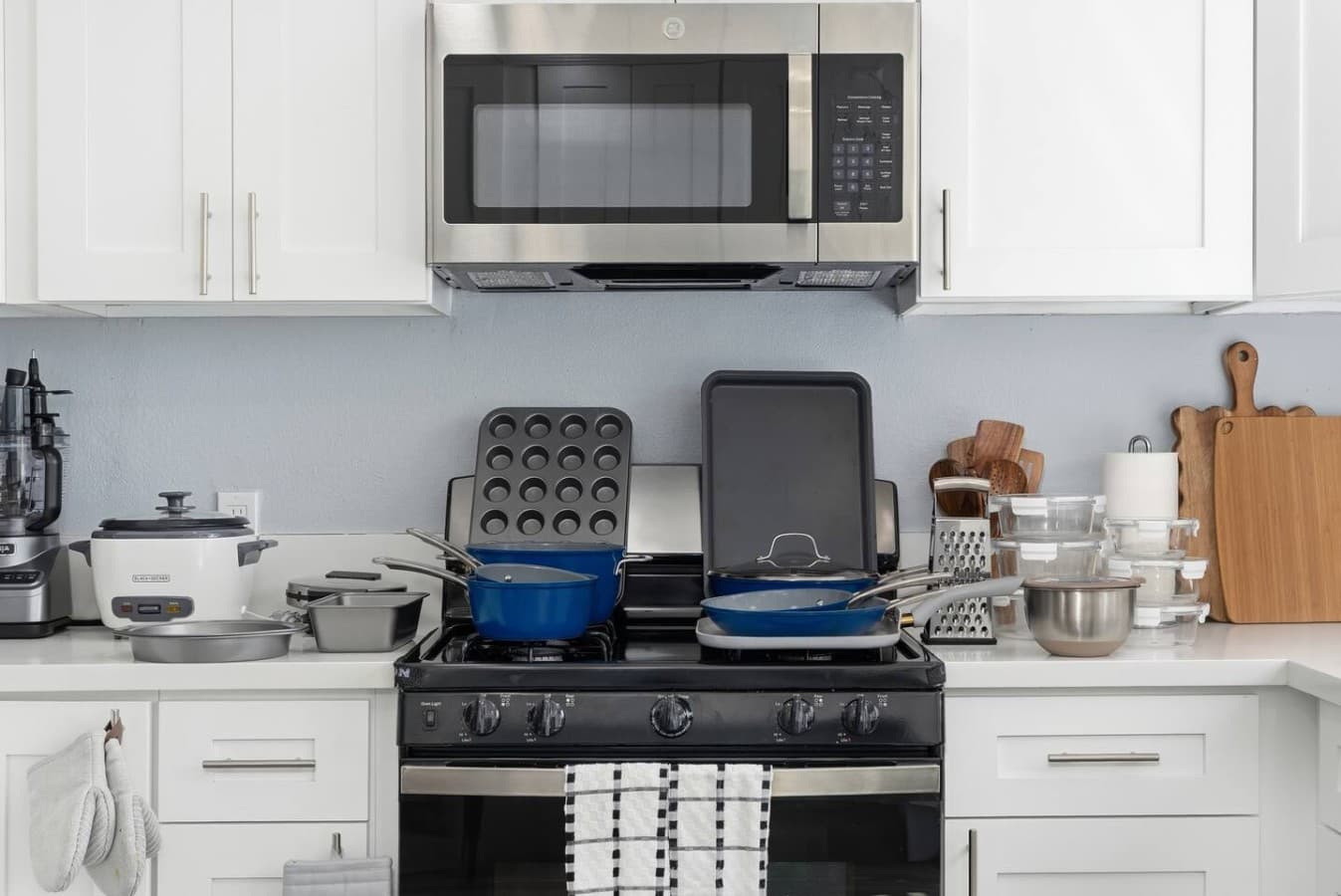 Fully equipped kitchen with cookware ready for home cooking.