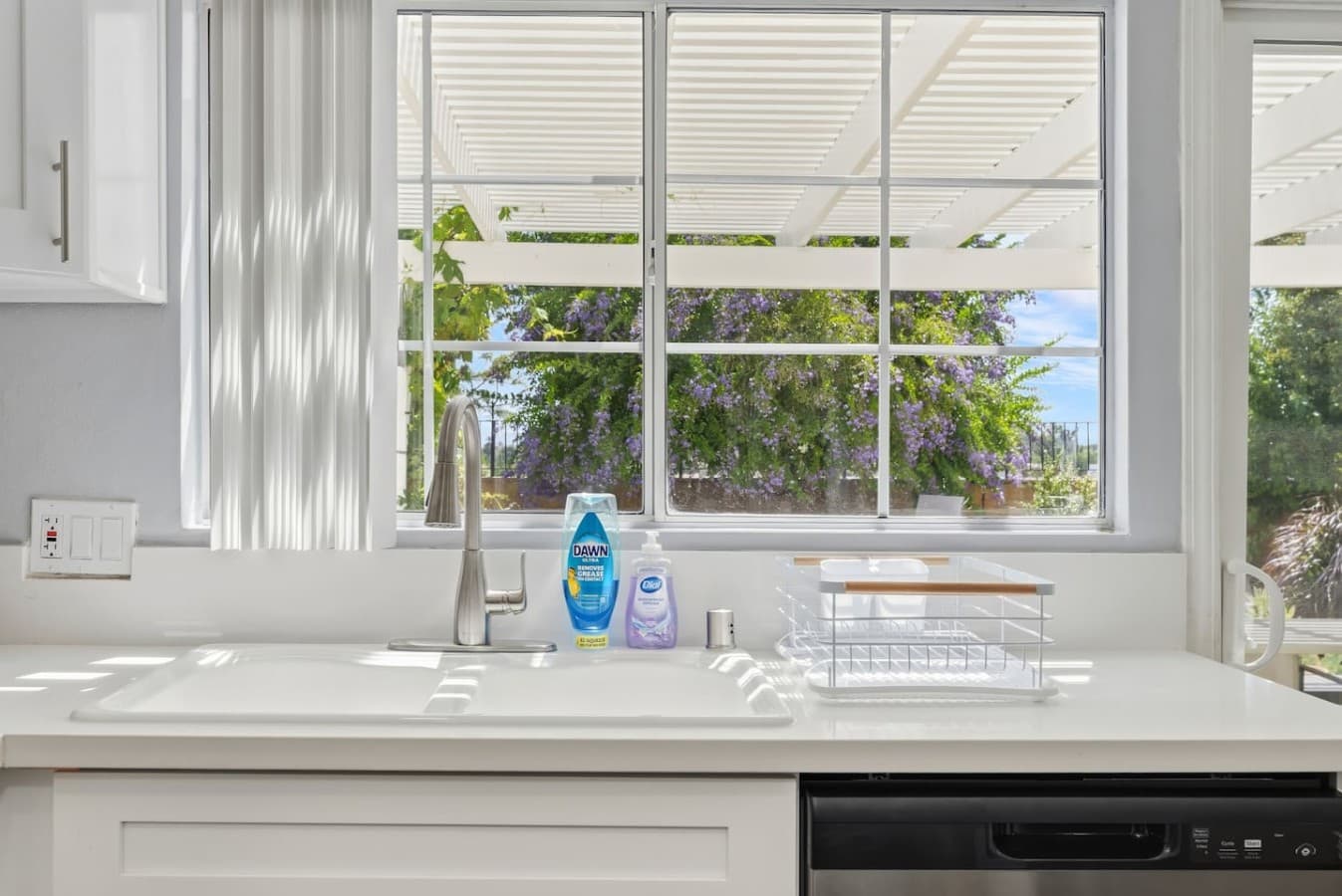 Sunny kitchen views overlooking the private backyard.