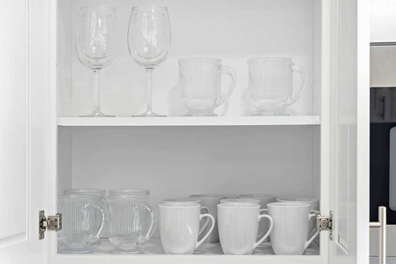 Glassware and mugs stocked for everyday use.
