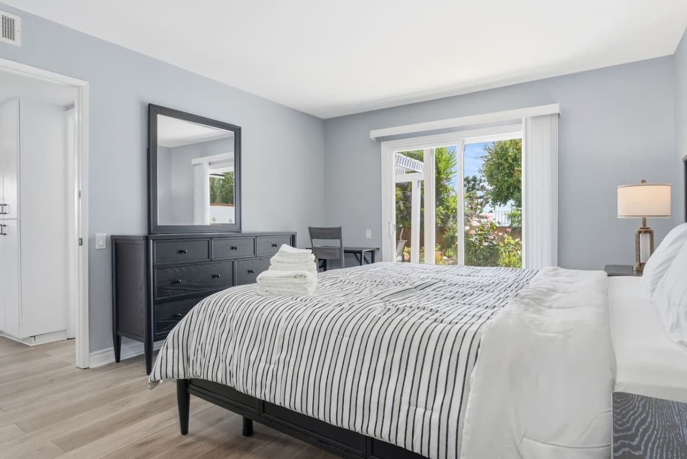 Spacious bedroom with natural light and room to unwind.