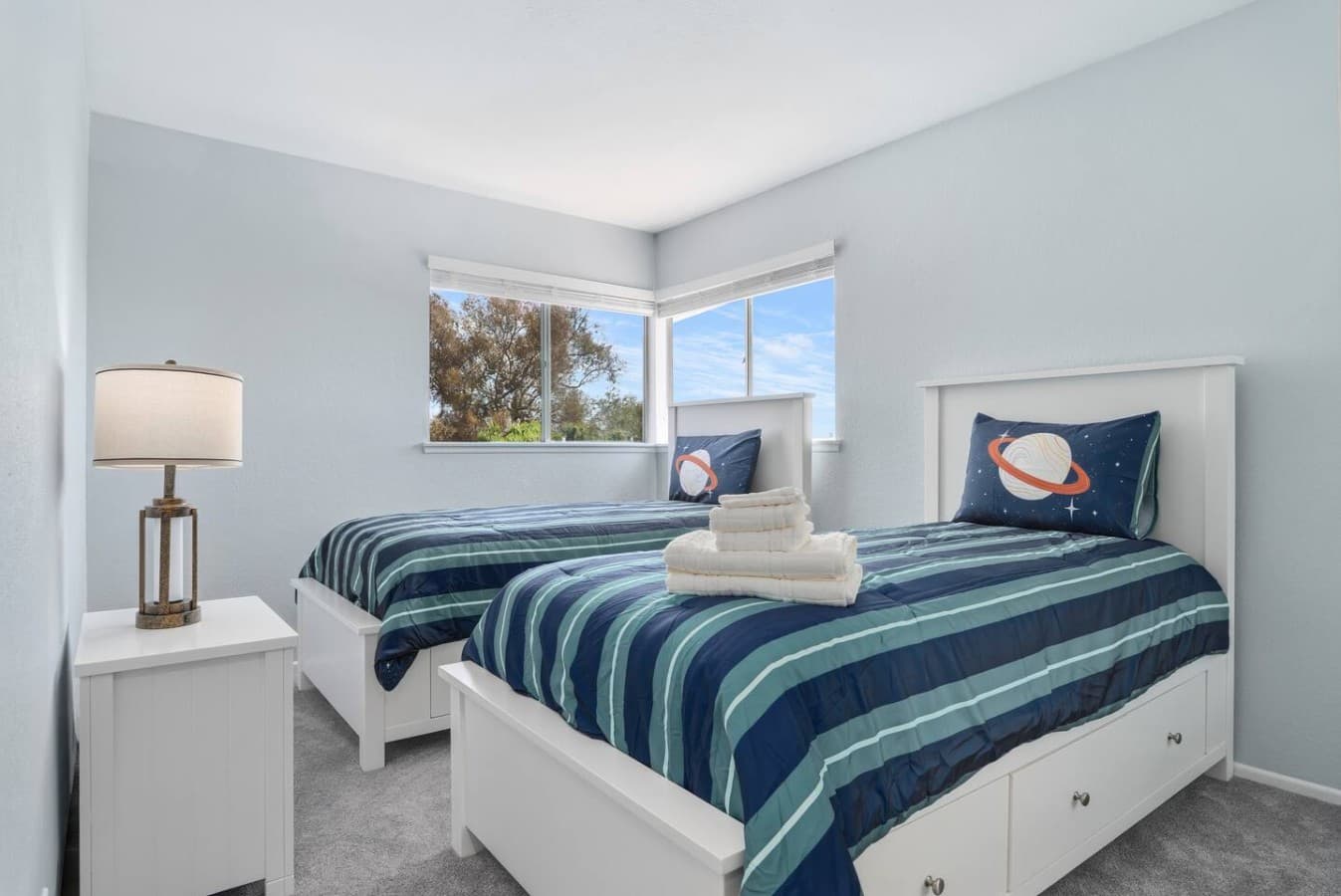 Comfortable bedroom with two twin beds perfect for families or friends.