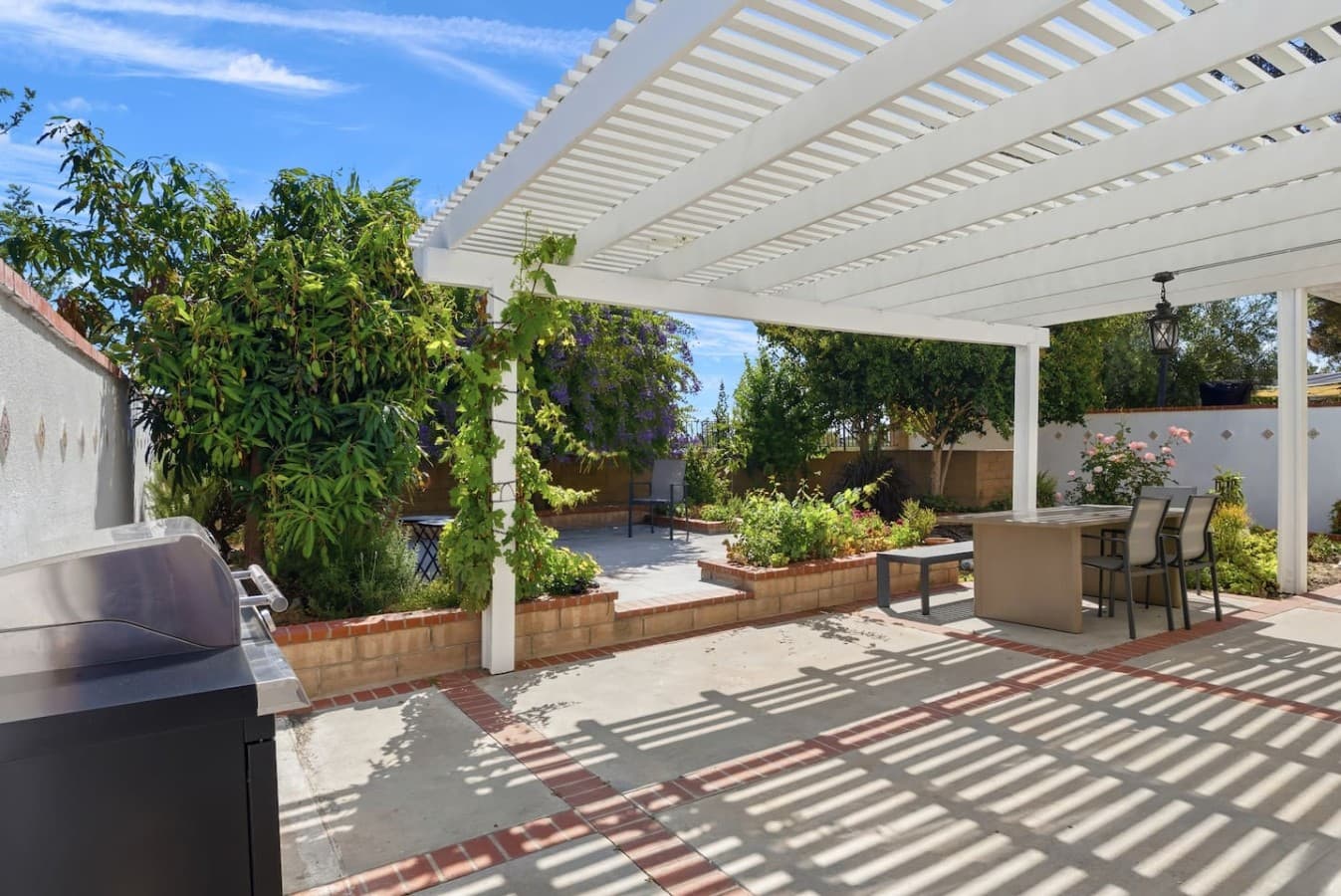 Private backyard patio with shaded seating and relaxing outdoor space.
