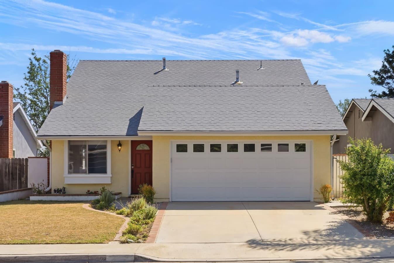 Easy self check in with driveway parking and welcoming curb appeal.