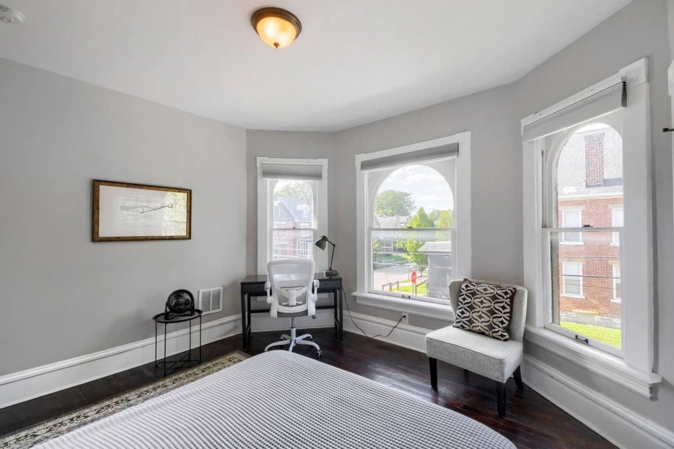 Enjoy a bright corner workspace by the windows, perfect for remote work or planning your next adventure.