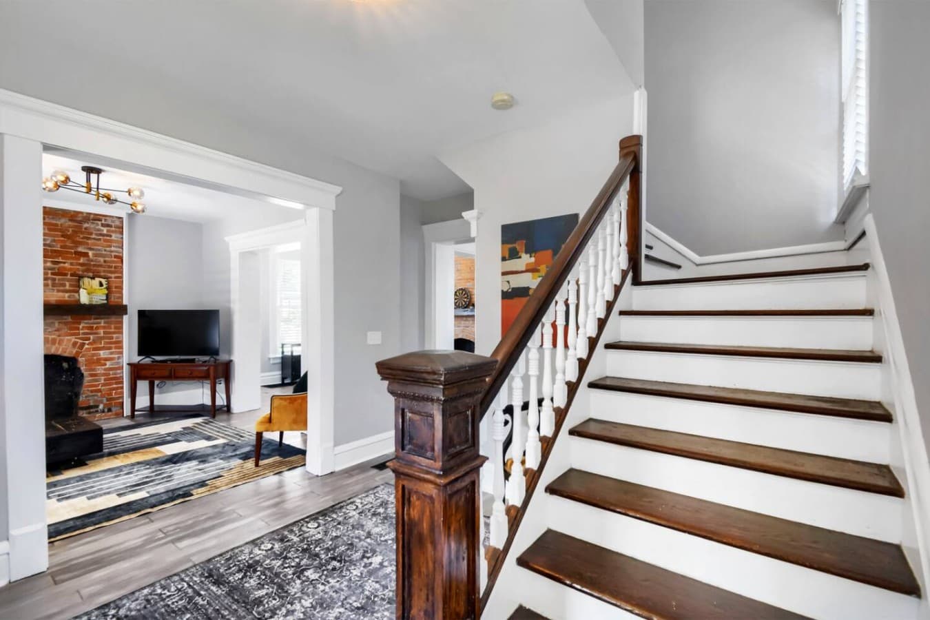 Grand entryway with a beautiful original staircase that adds historic charm from the moment you arrive.