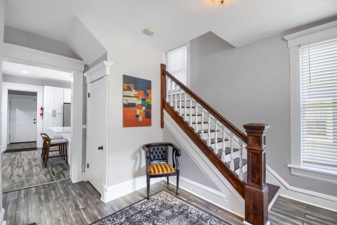 Elegant staircase and entry hall showcase the home's classic character with modern updates throughout.