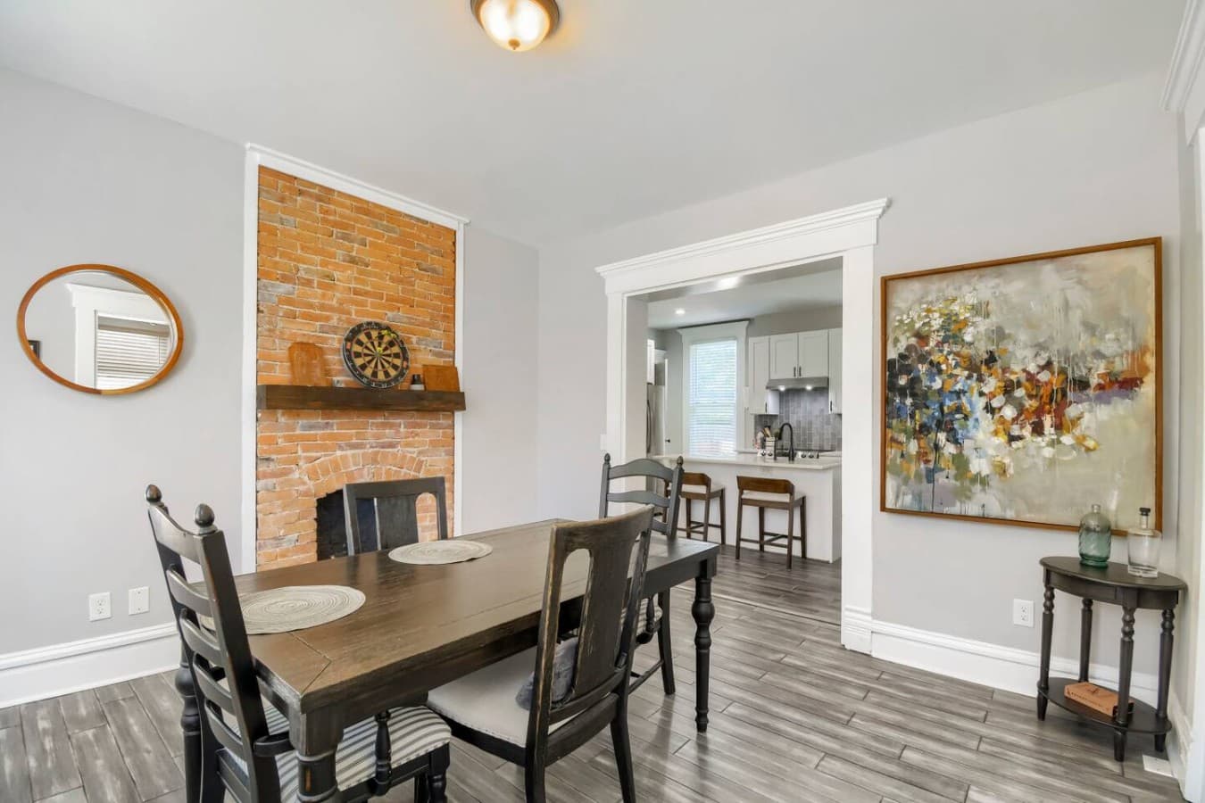 Gather around the dining table for shared meals with easy access to the kitchen and living room.