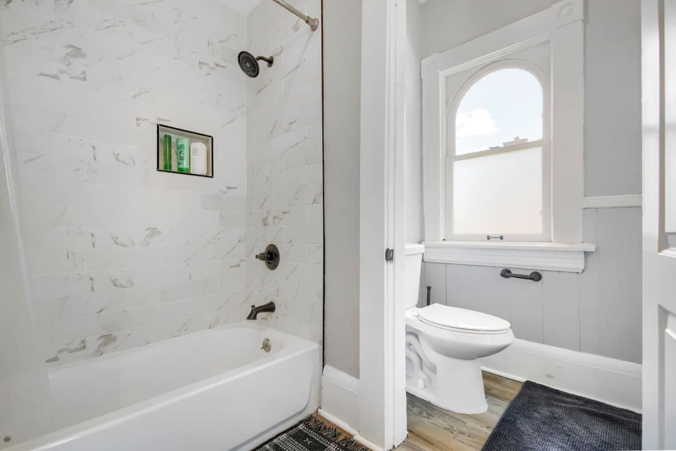 Refresh in the stylish bathroom with a full bathtub, modern fixtures, and a bright, clean design.
