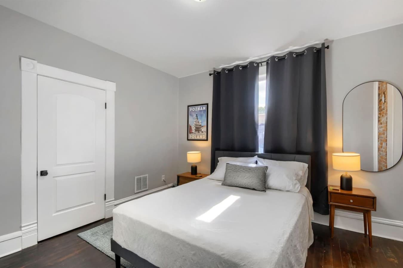 Bright and inviting bedroom featuring blackout curtains and a peaceful atmosphere for restful nights.