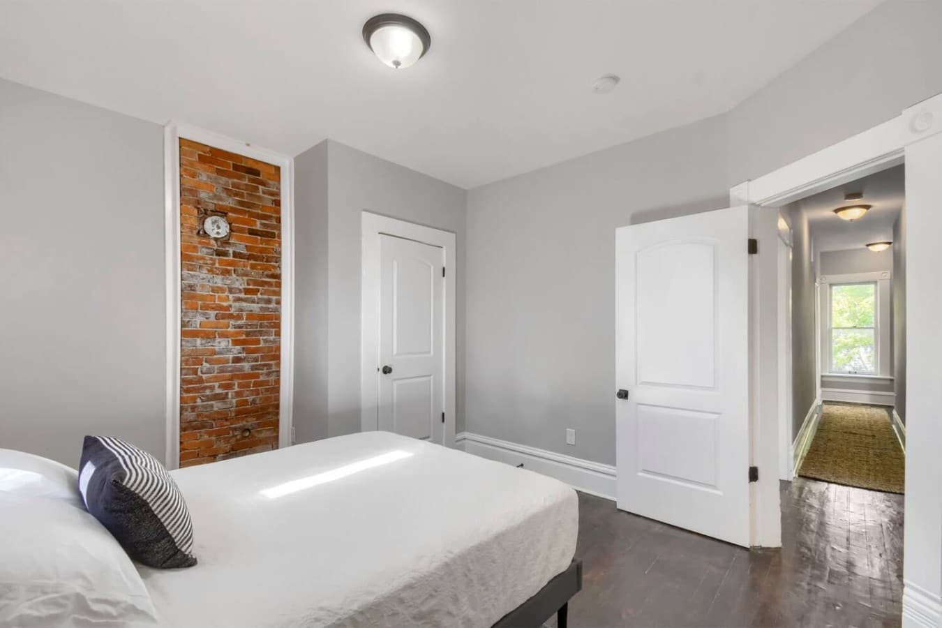 Stylish bedroom with charming historic details, modern furnishings, and plenty of space to unwind.