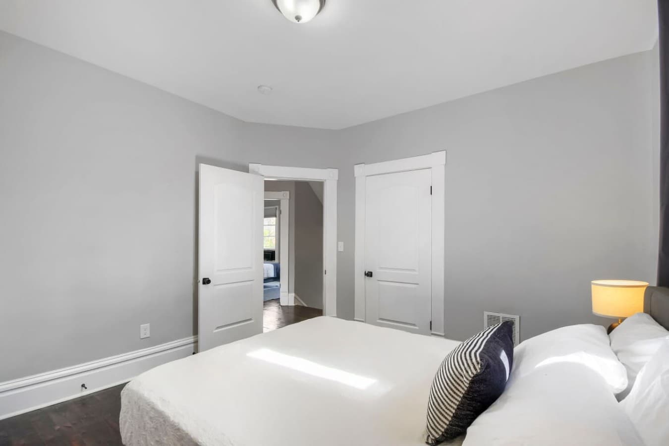 Comfortable bedroom with easy access to the hallway and closet, offering a quiet retreat after a day of exploring.