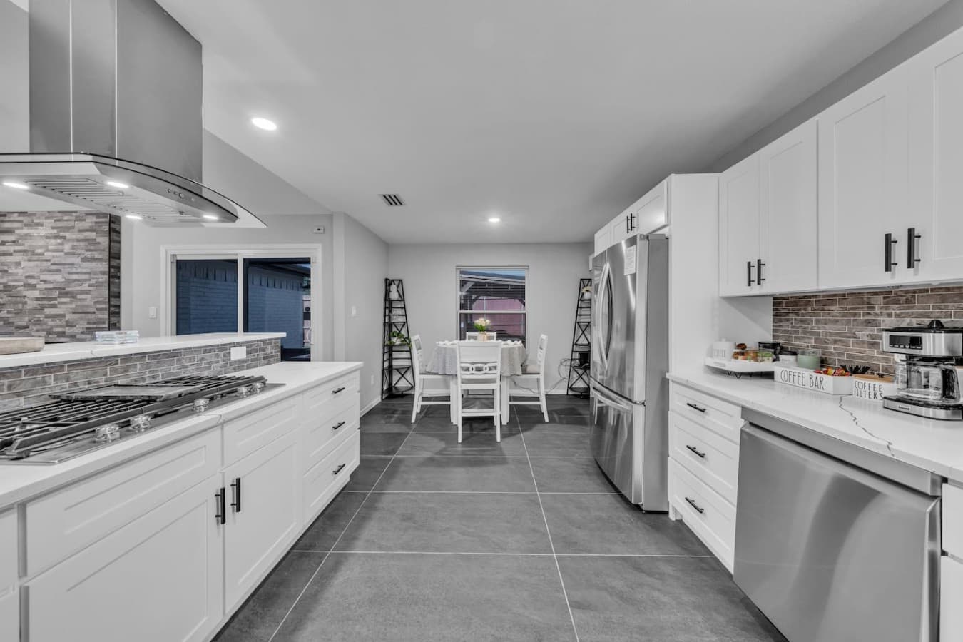 Long galley style kitchen connecting seamlessly to the dining area for easy entertaining and family gatherings.