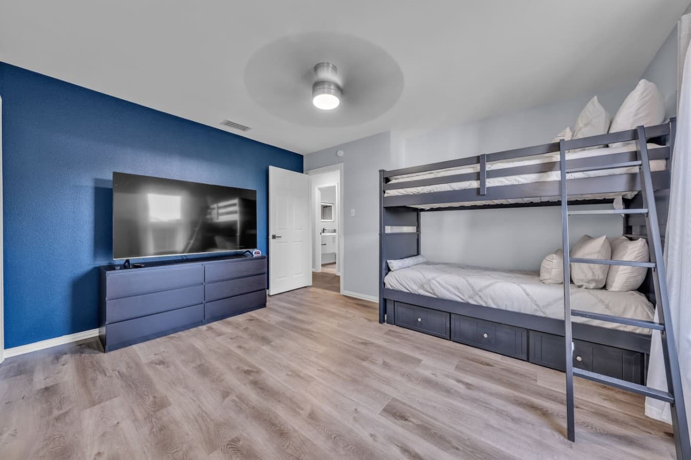 Perfect for families and groups, this bunk room includes a large smart TV and flexible sleeping arrangements.