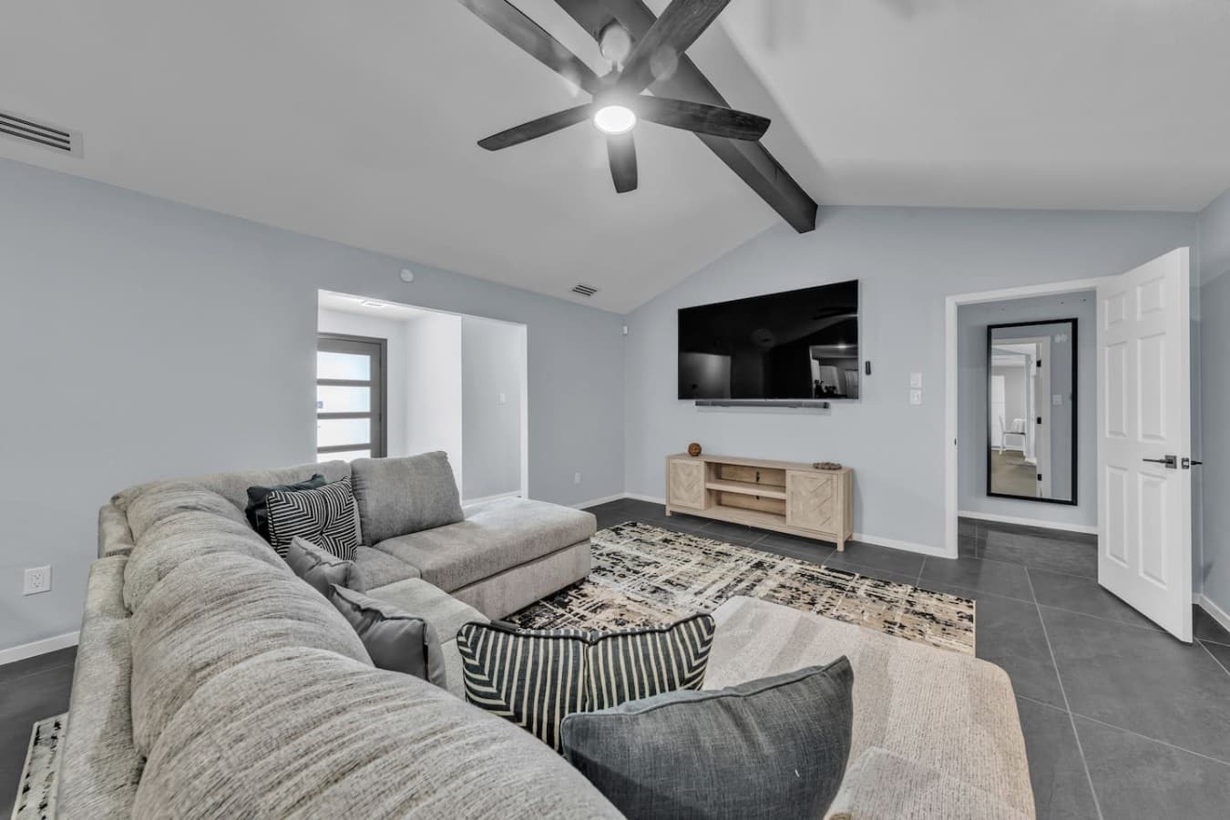 Unwind with comfortable seating, a large smart TV, and a stylish open concept design made for movie nights and quality time.