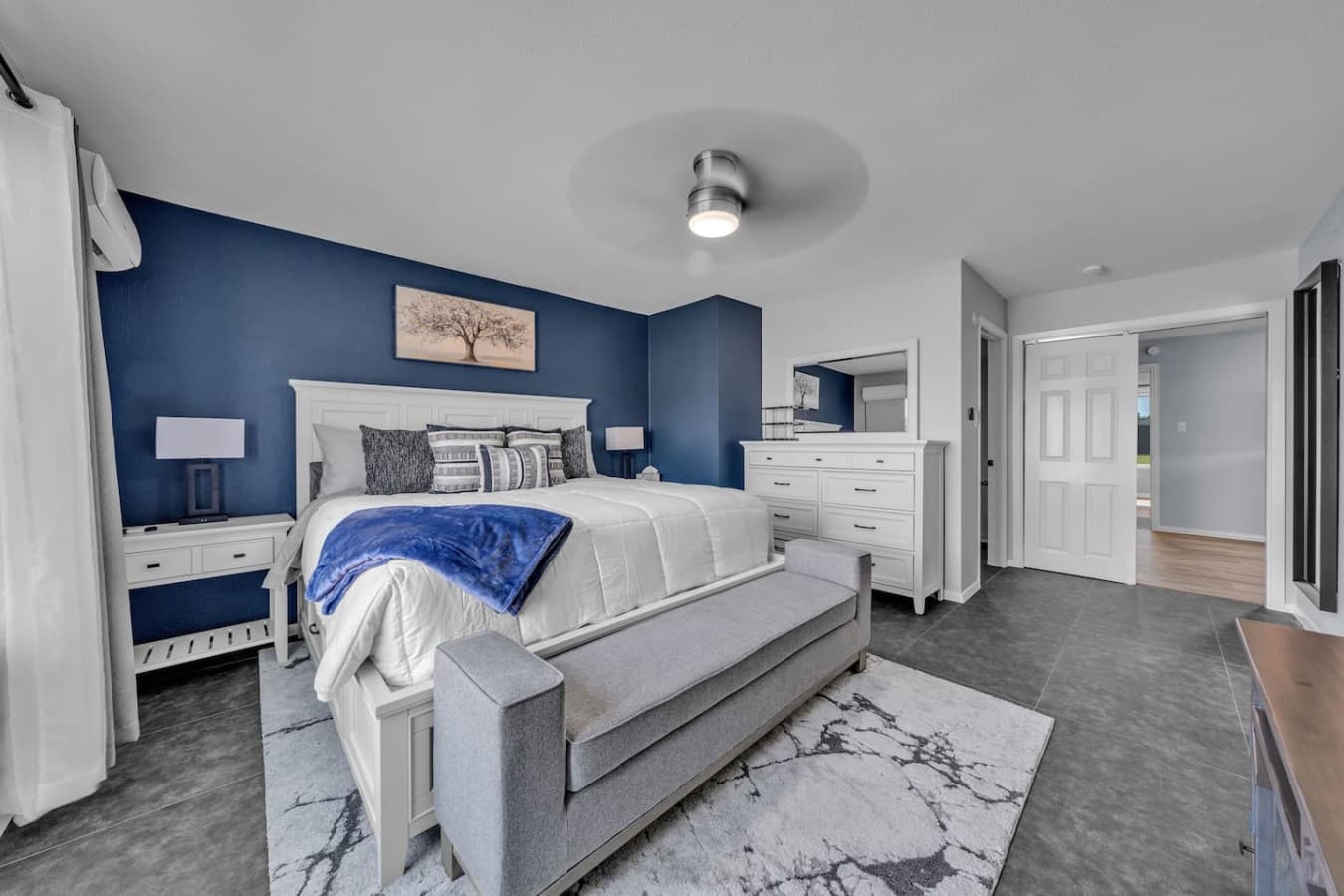 Relax in a beautifully styled retreat with plush bedding, calming décor, and generous storage space.