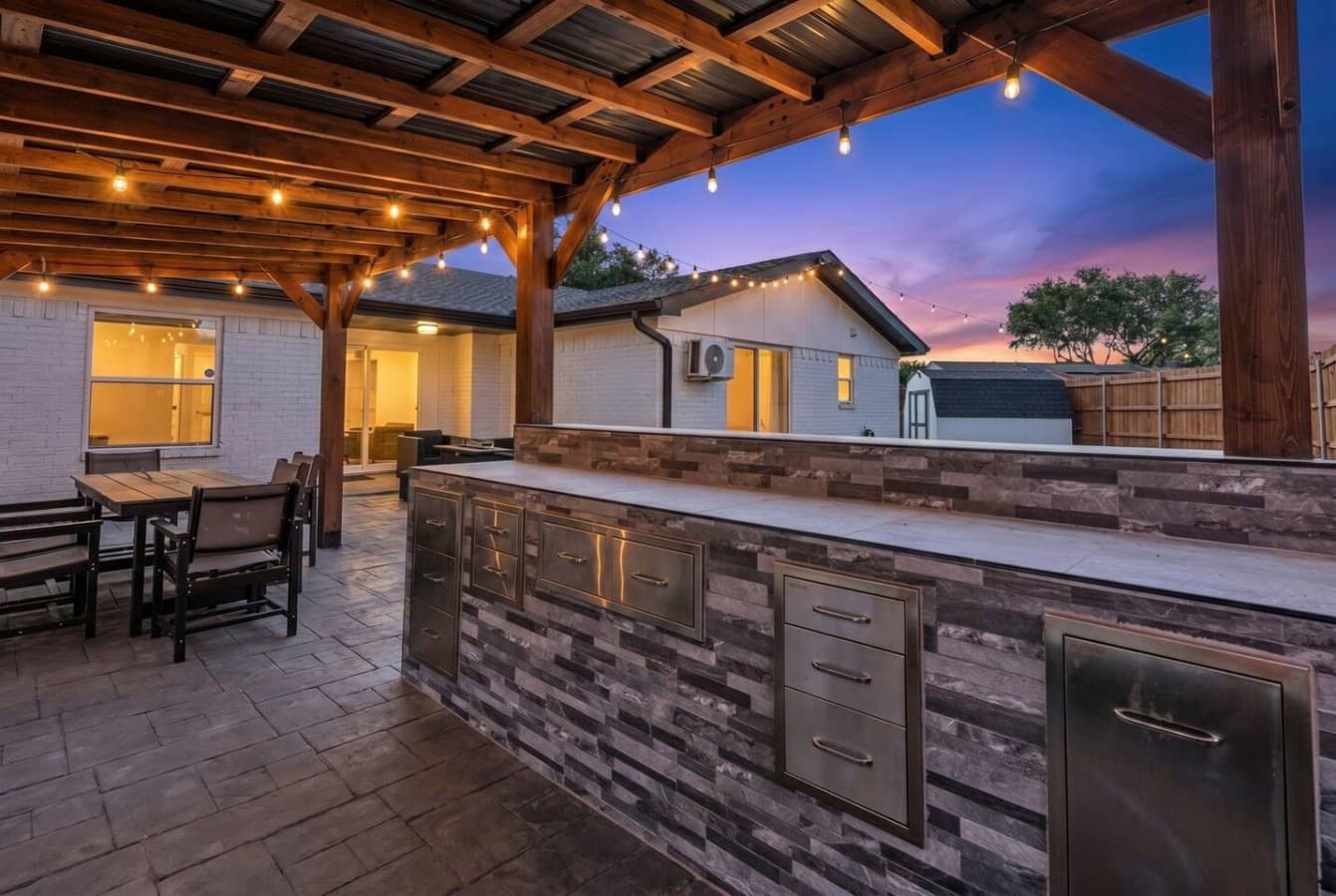 Stylish outdoor kitchen and bar area designed for effortless entertaining from day to night.