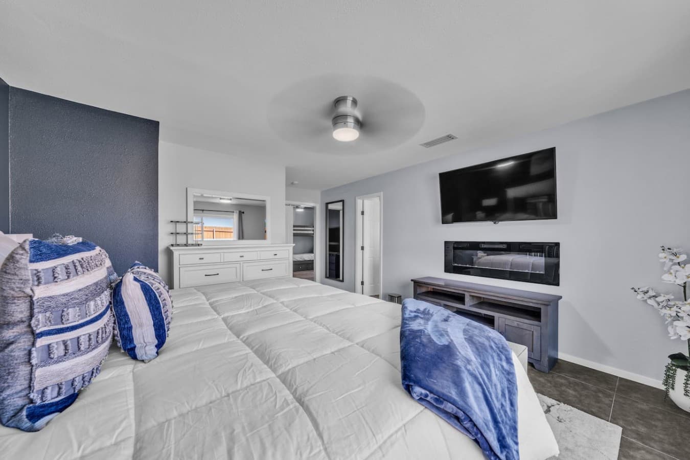 Enjoy your favorite shows from bed with a large smart TV and a cozy, private atmosphere.
