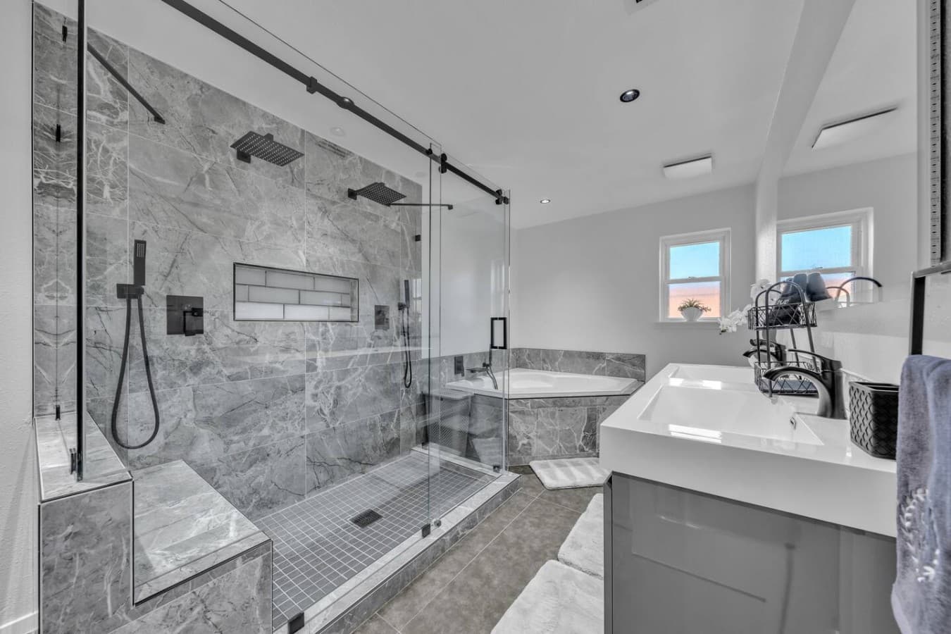 Oversized walk in shower with modern finishes and a bright, open design that feels like a private retreat.