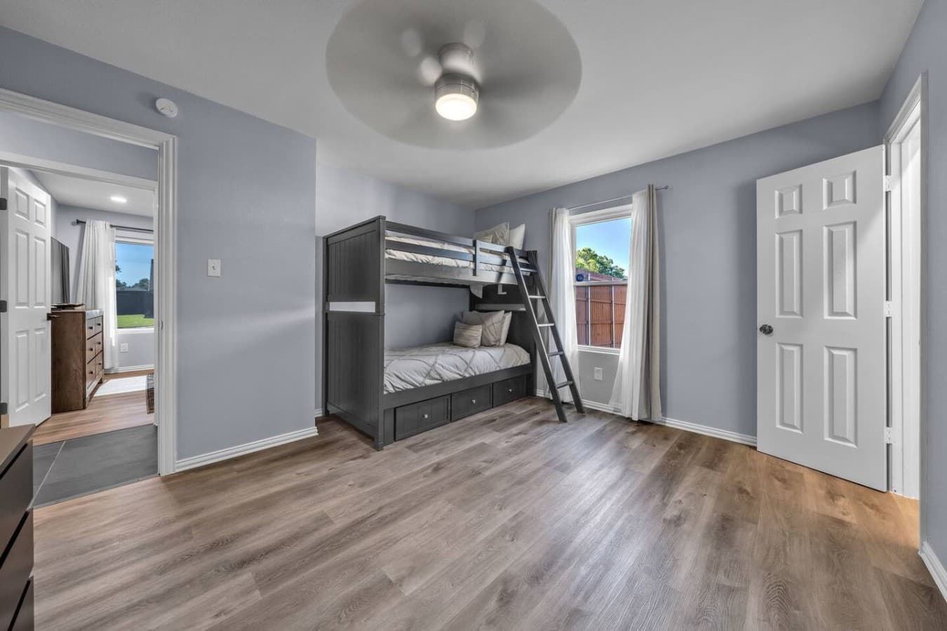 Fun and spacious bunk room with plenty of floor space for kids, friends, or extra guests.