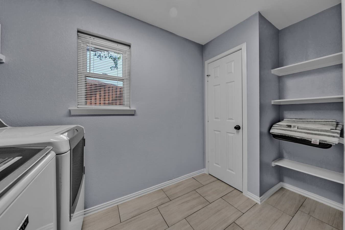 Dedicated laundry room with a full size washer and dryer to make longer stays easy and convenient.