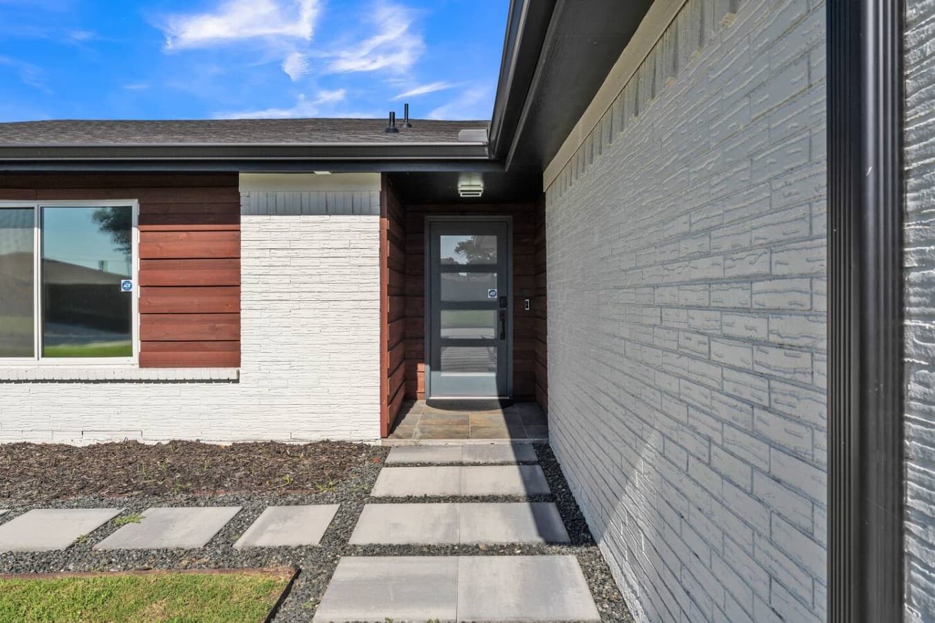 Modern front entry with a clean design and convenient self check in for a seamless arrival experience.