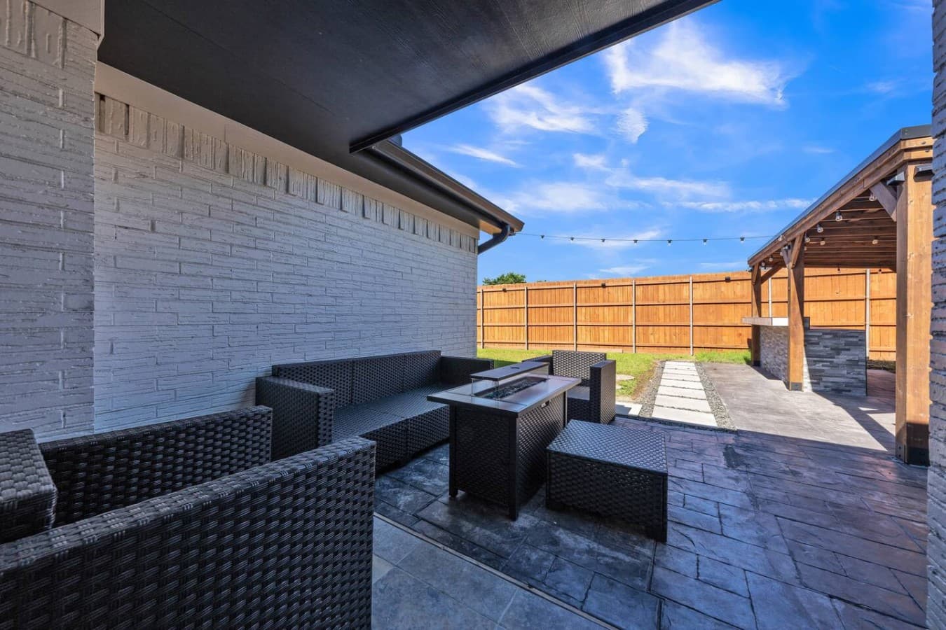 Private backyard retreat offering multiple seating areas and a peaceful setting to unwind outdoors.