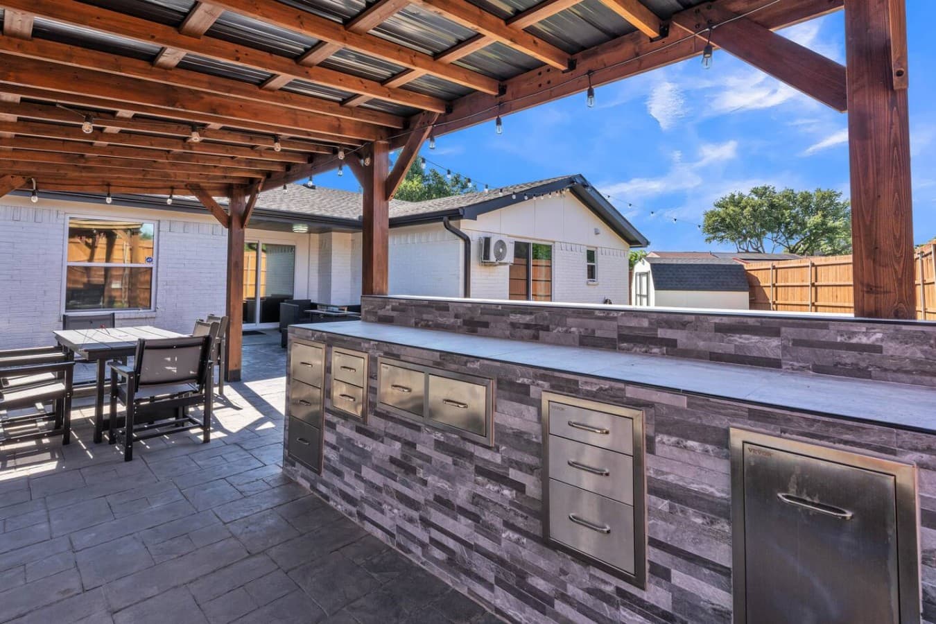 Custom outdoor bar and serving area perfect for entertaining, dining, and gathering with friends and family.