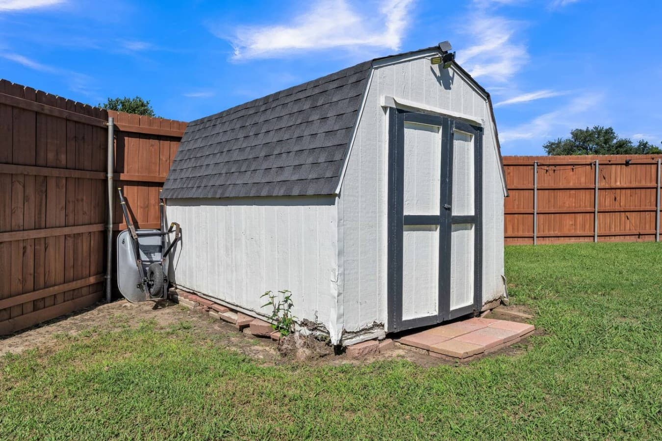Backyard storage shed available for added functionality and extra space during your stay.