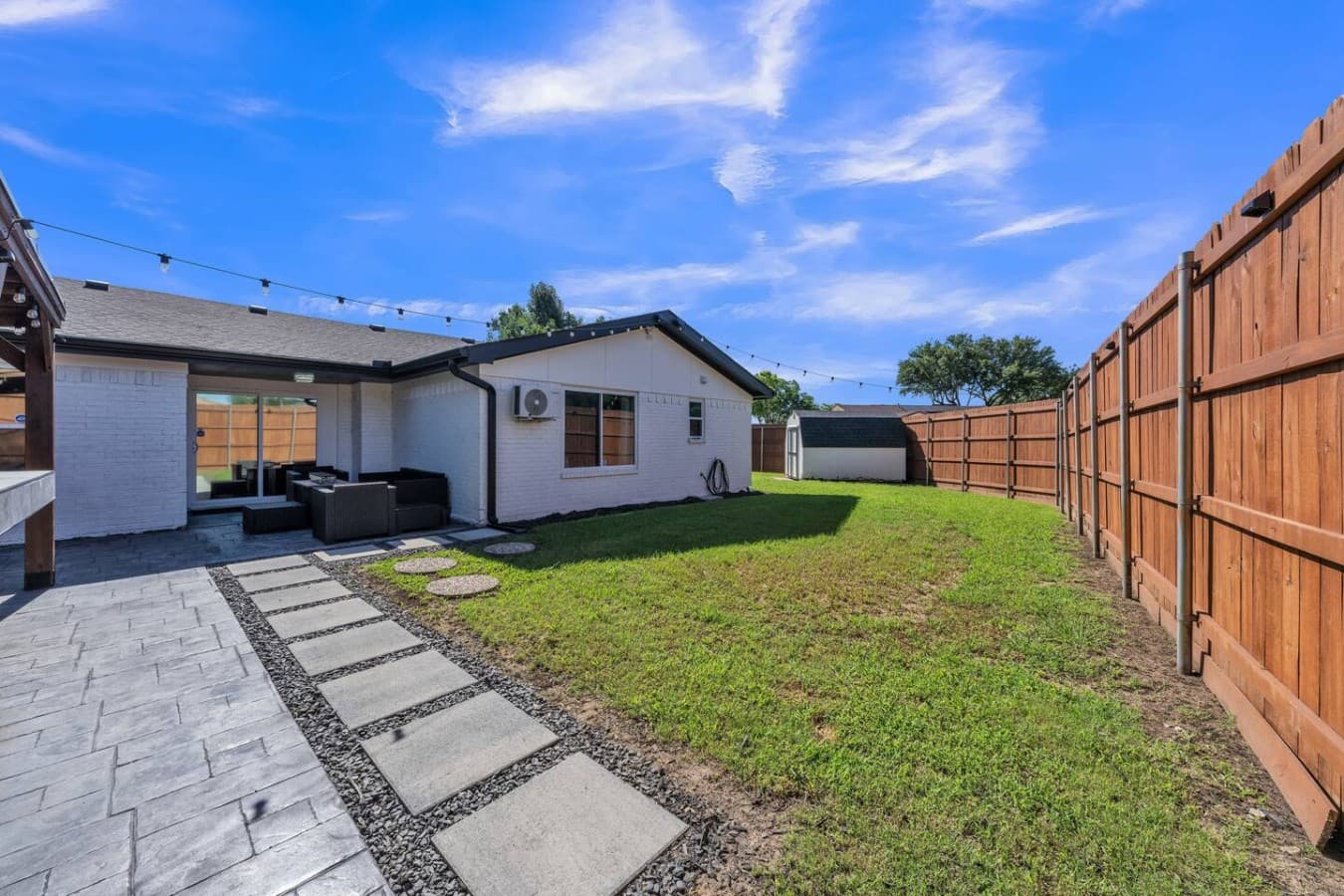 Large private yard with open green space for games, relaxation, and enjoying the fresh air.