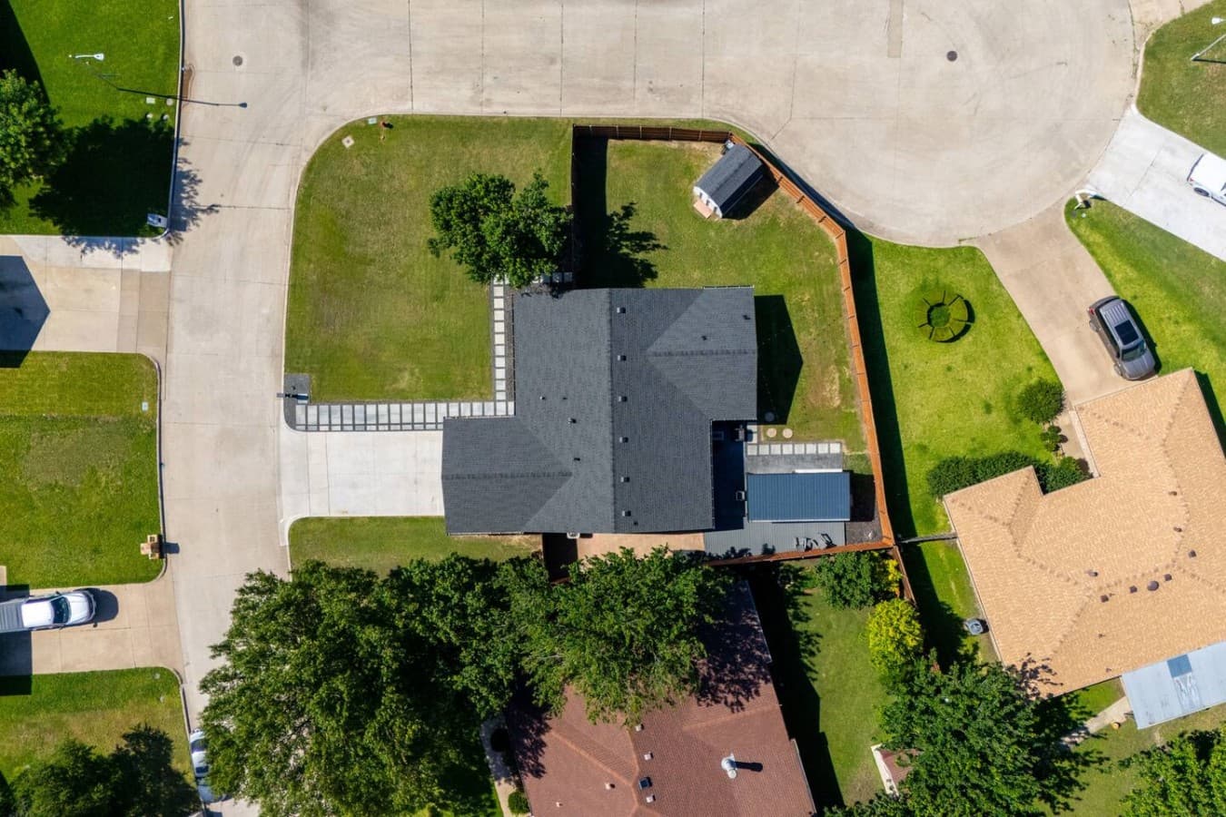 Bird's eye view showcasing the full property layout, oversized lot, and beautifully maintained grounds.