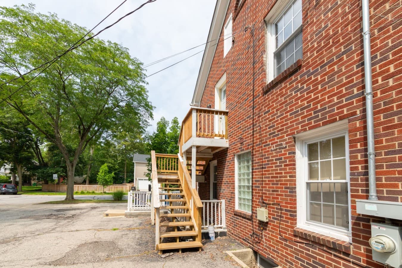 Exterior view showcasing convenient entry and parking access.