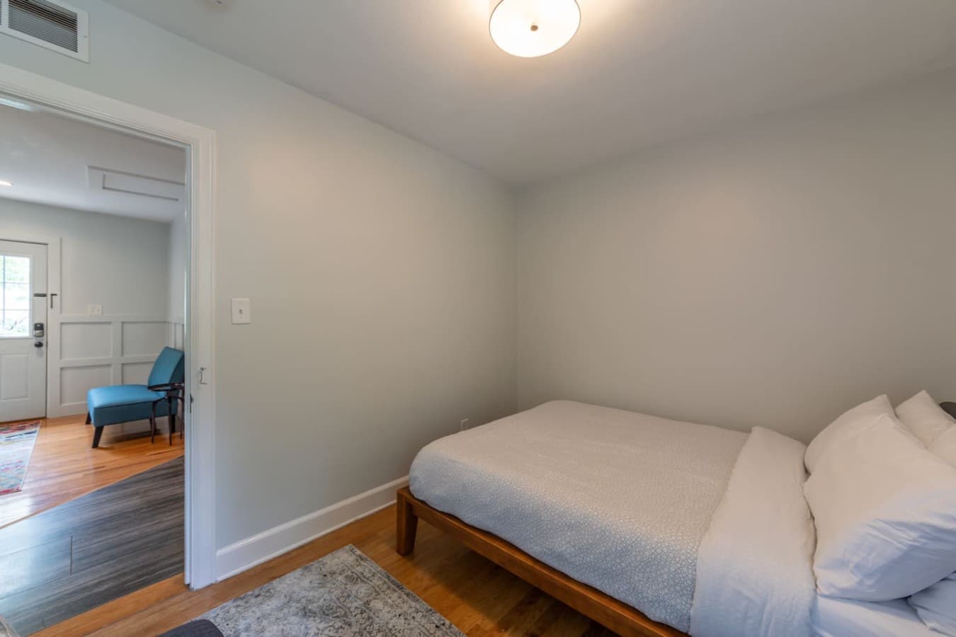 Simple and comfortable bedroom designed for a restful night's sleep.