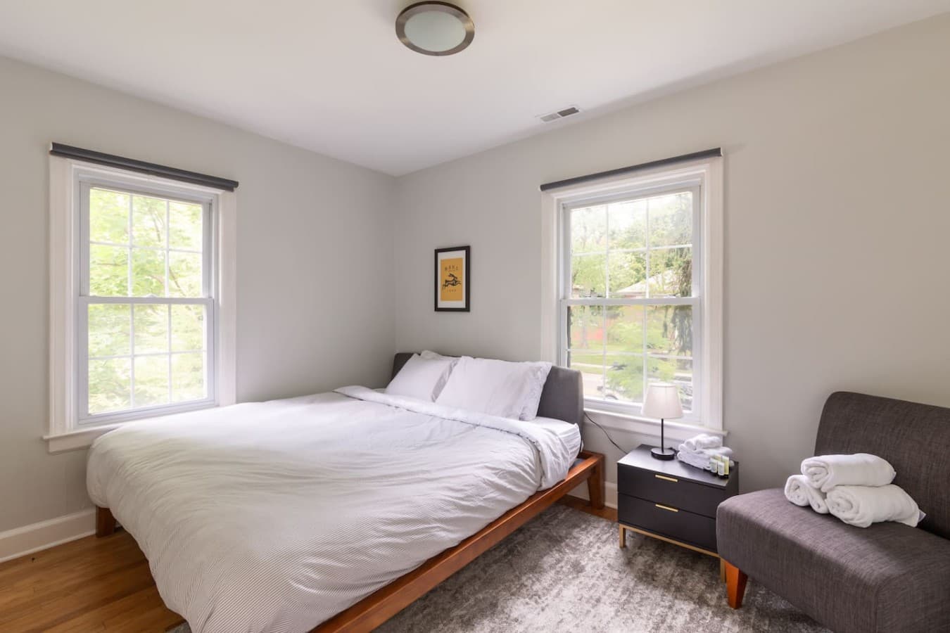 Serene bedroom with plush bedding and views of the surrounding greenery.