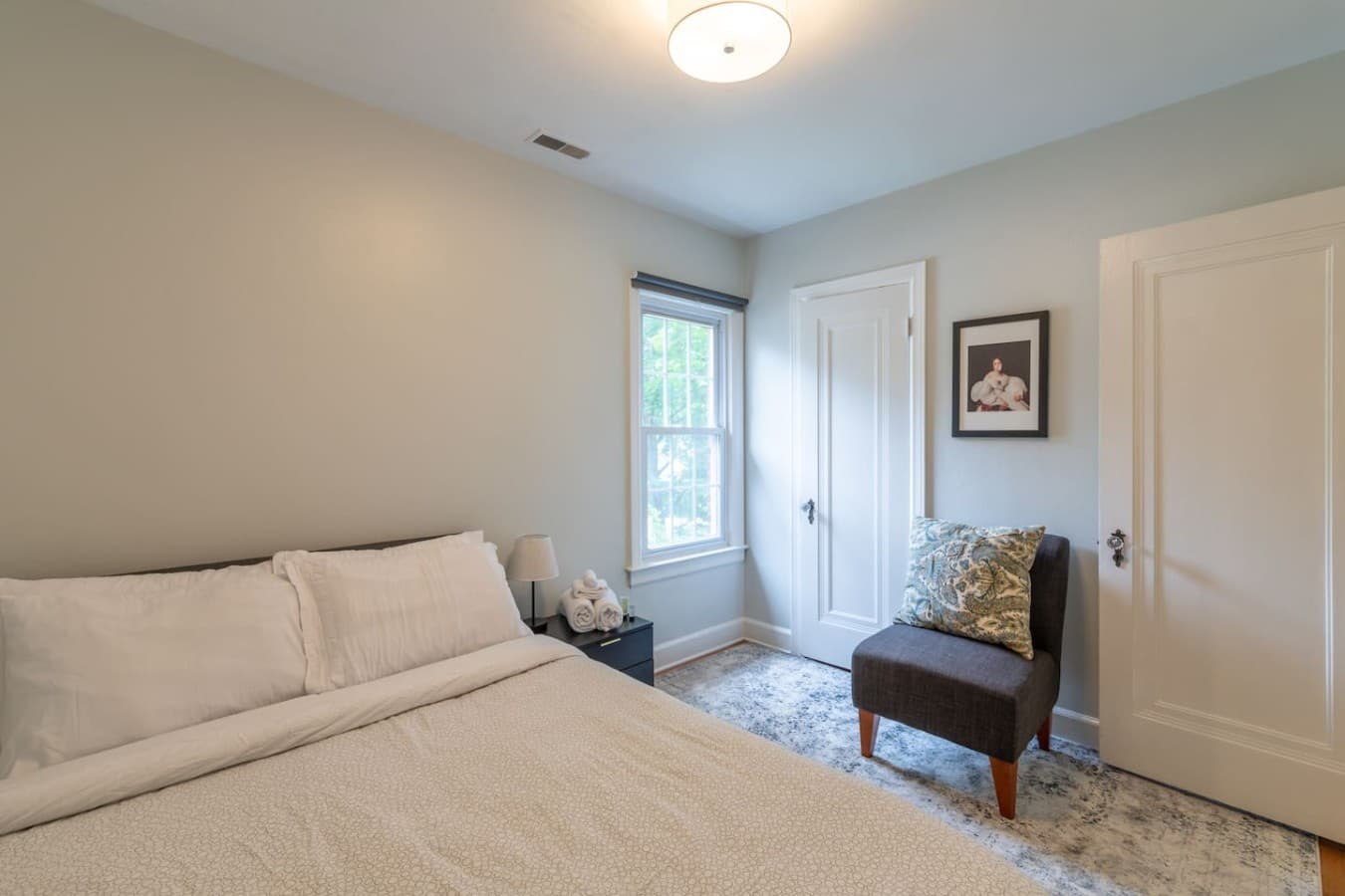 Relaxing bedroom with a cozy queen bed and dedicated closet space.